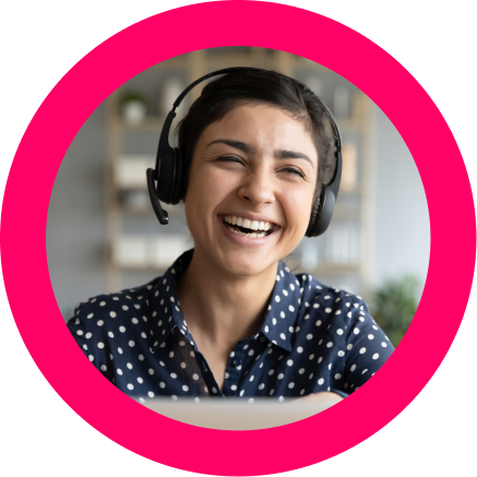 Customer service woman wearing a headset laughing while on a customer support call