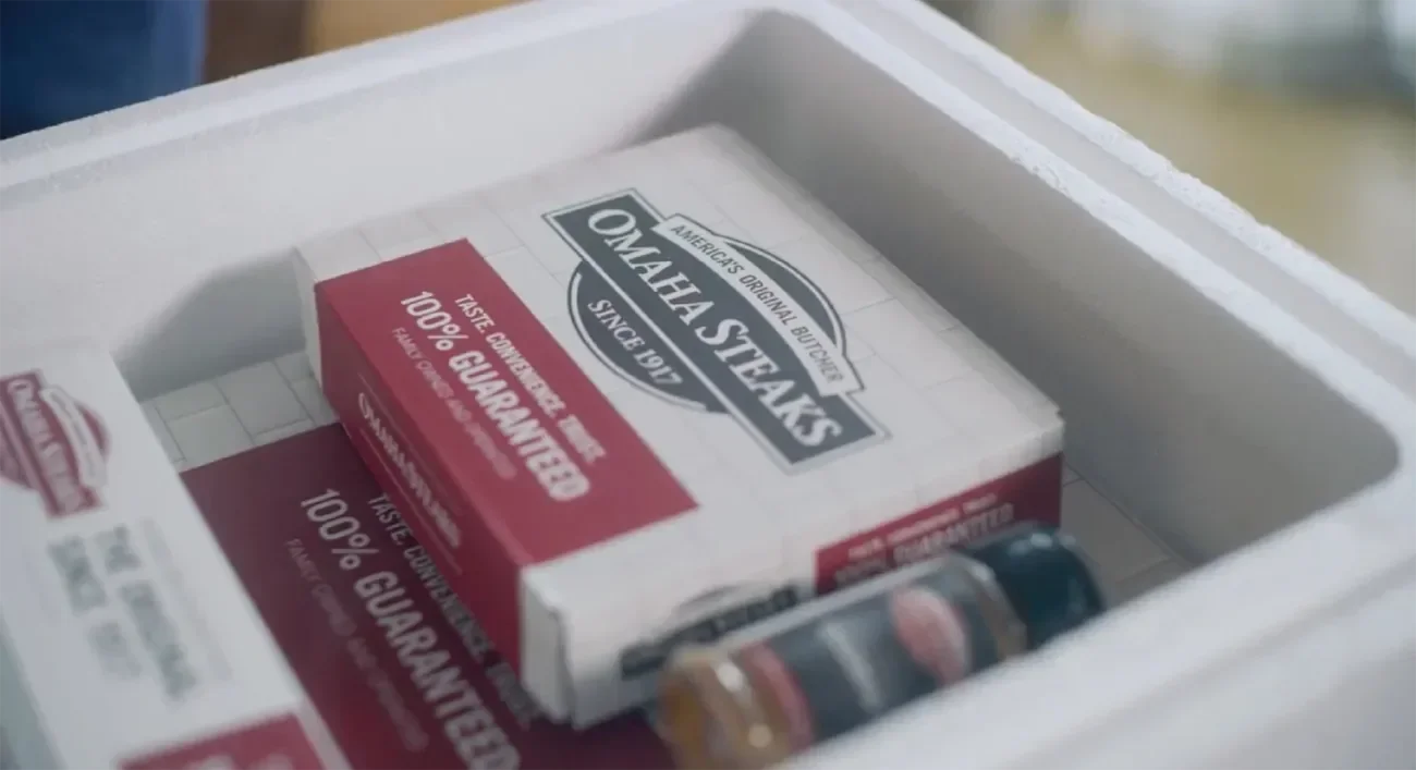 Omaha Steaks boxes and seasoning in a cooler.