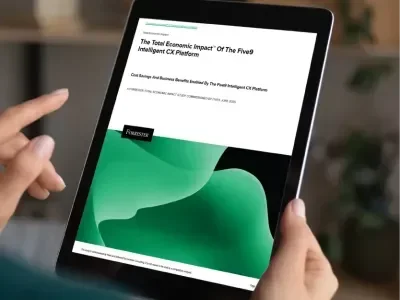 Hands holding a tablet displaying a document with green waves and text.