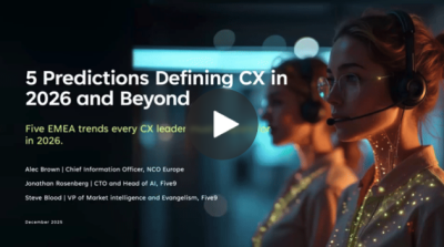 Woman wearing a headset, focused on a screen with glowing accents in a dark environment.