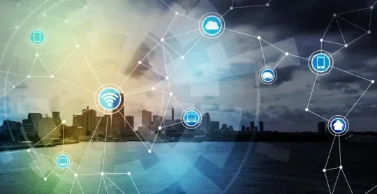City scape background with connecting symbols including wifi, cloud, mobile etc