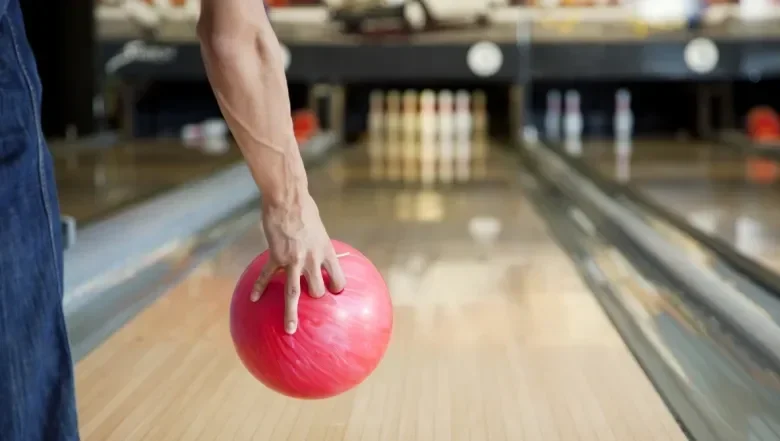 Bowling alley with red bowling ball