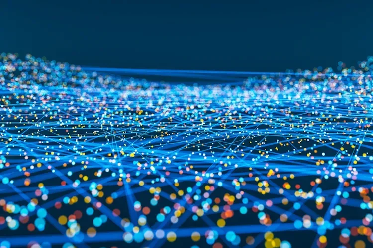 A network of interconnected nodes and lines against a dark blue background representing AI
