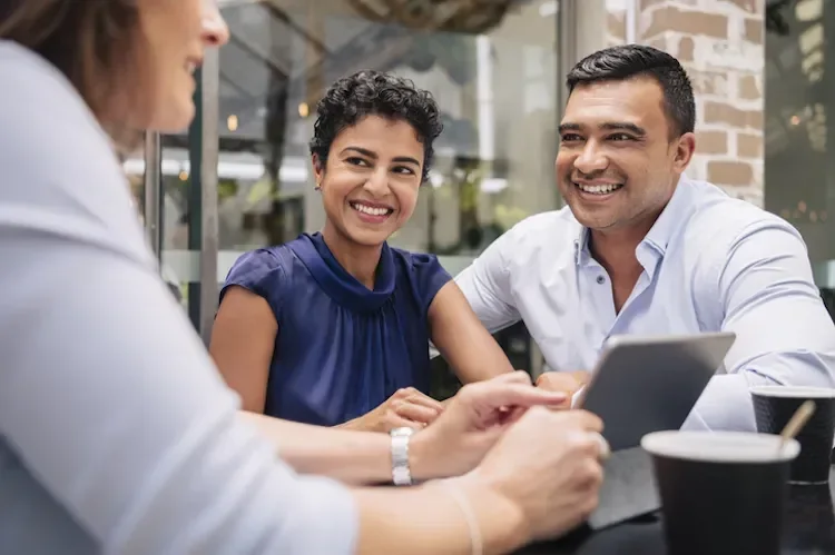 people at a table doing business