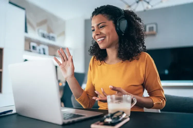 woman talking on the phone at a computer