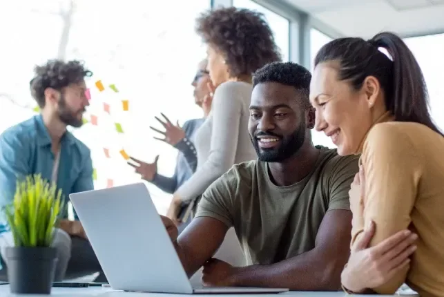 People looking at computer