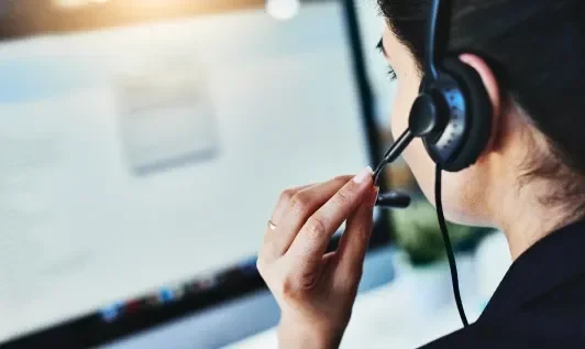 Woman Using Headset at Work