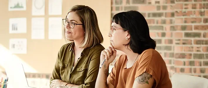 Women reading at a desk