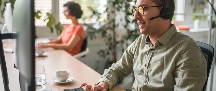 Man using headset and desktop