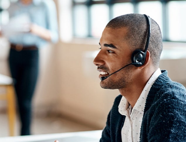 Man Using Computer and Headset