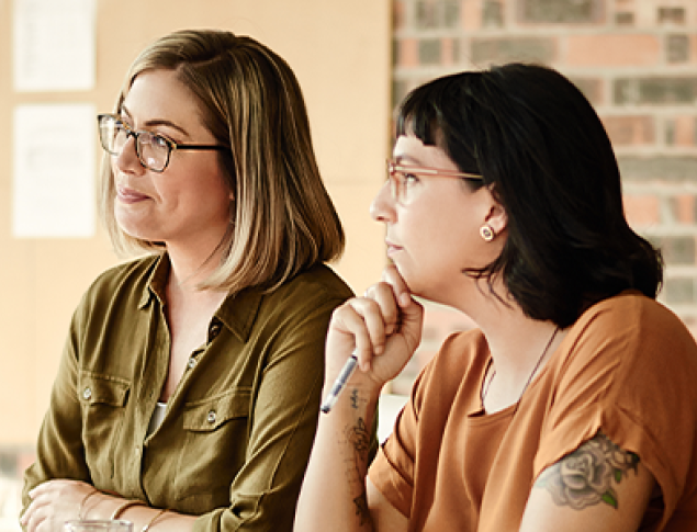 Women reading at a desk
